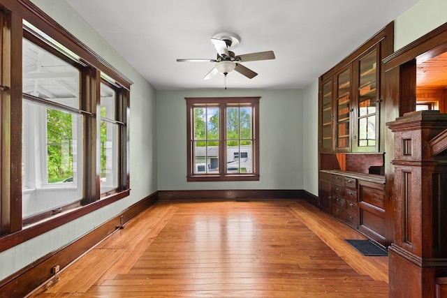 8001 S Jackson Rd, Jackson, MI 49201 - unfurnished room featuring light wood-type flooring, a ceiling fan, and baseboards