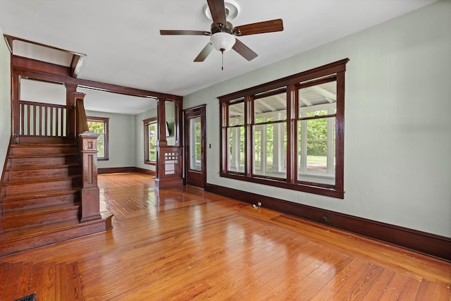8001 S Jackson Rd, Jackson, MI 49201 - foyer entrance with baseboards, a ceiling fan, stairway, and light wood-type flooring