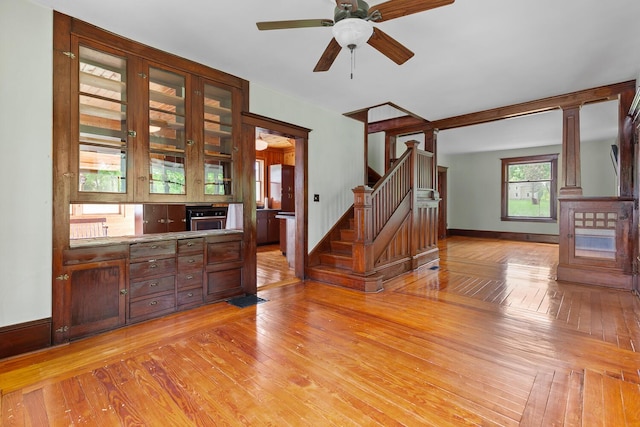 8001 S Jackson Rd, Jackson, MI 49201 - interior space with light wood-style flooring, stairway, baseboards, and ceiling fan