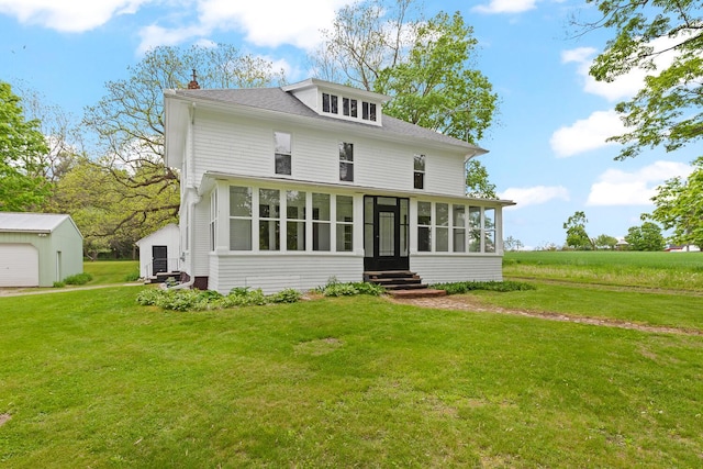 8001 S Jackson Rd, Jackson, MI 49201 - view of front facade featuring a sunroom, entry steps, a front yard, and a chimney
