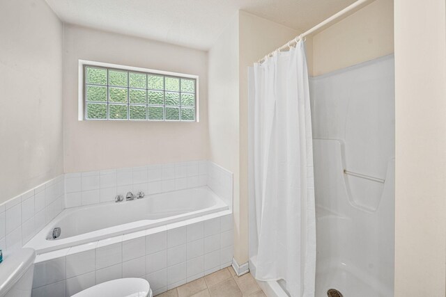 64711 Shorewood Ln, Cassopolis, MI 49031 - bathroom with toilet, curtained shower, a bath, and tile patterned flooring