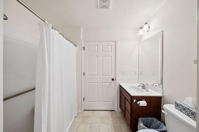 64711 Shorewood Ln, Cassopolis, MI 49031 - bathroom with toilet, a textured ceiling, vanity, tile patterned floors, and a shower with curtain