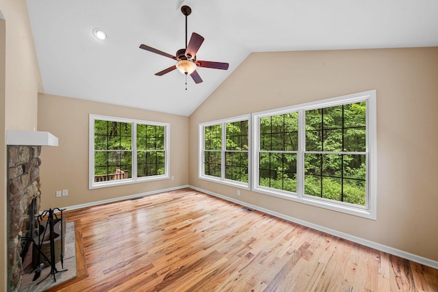 64711 Shorewood Ln, Cassopolis, MI 49031 - unfurnished living room with ceiling fan, lofted ceiling, wood finished floors, baseboards, and a fireplace