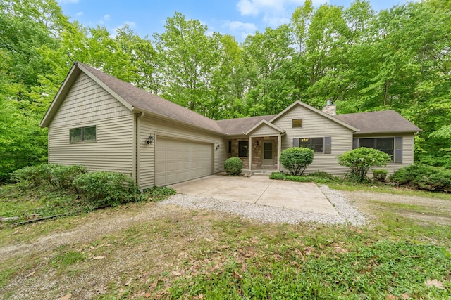 64711 Shorewood Ln, Cassopolis, MI 49031 - ranch-style home featuring a garage, concrete driveway, a chimney, and a shingled roof