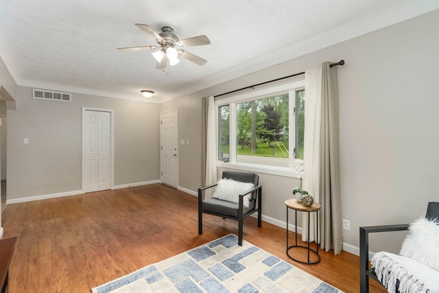 4121 Quebec St, Auburn Hills, MI 48326 - sitting room featuring a ceiling fan, wood finished floors, and baseboards