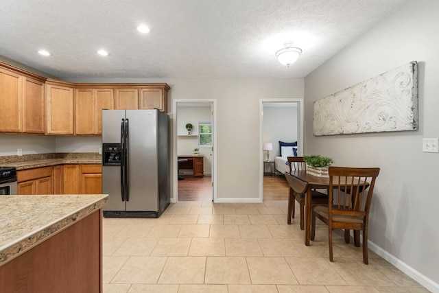 4121 Quebec St, Auburn Hills, MI 48326 - kitchen featuring stainless steel fridge, baseboards, a textured ceiling, recessed lighting, and brown cabinetry