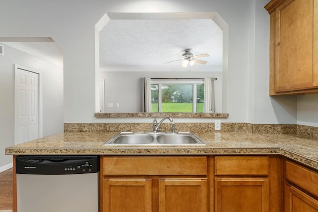 4121 Quebec St, Auburn Hills, MI 48326 - kitchen featuring dishwasher, a sink, a ceiling fan, brown cabinetry, and a textured ceiling