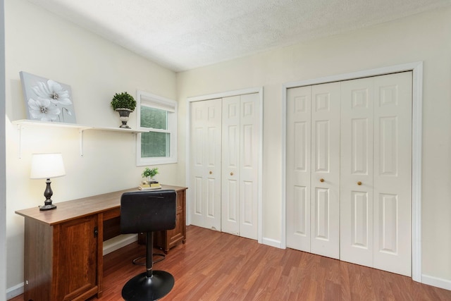 4121 Quebec St, Auburn Hills, MI 48326 - office with light wood-style floors, a textured ceiling, and baseboards