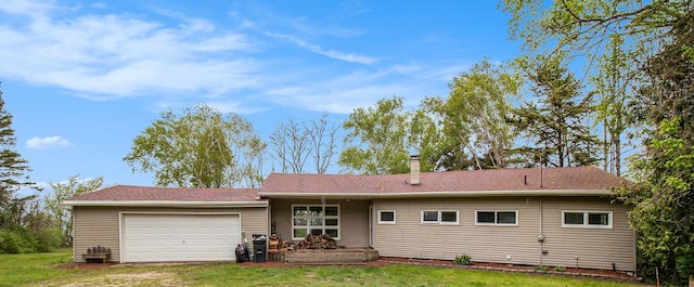 4771 S Lakeshore Dr, Ludington, MI 49431 - ranch-style house with an attached garage, a front yard, a chimney, and driveway