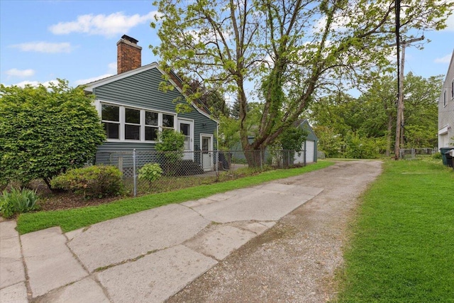 3364 Inman St, Ferndale, MI 48220 - view of side of home featuring a chimney and driveway