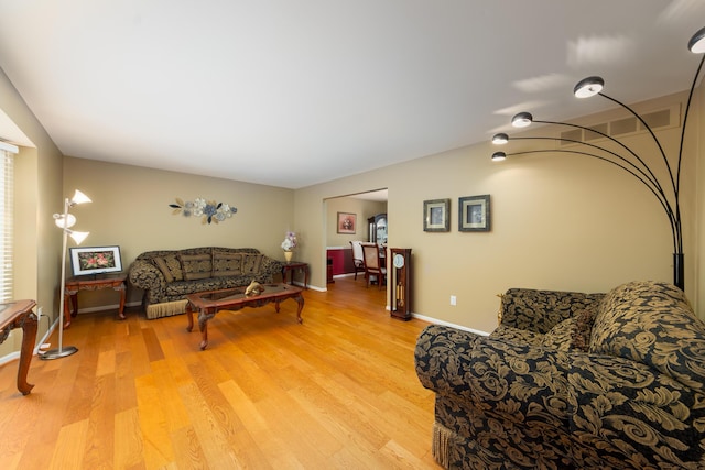 24609 Redwing Dr, Novi, MI 48374 - living room featuring light wood-style floors and baseboards