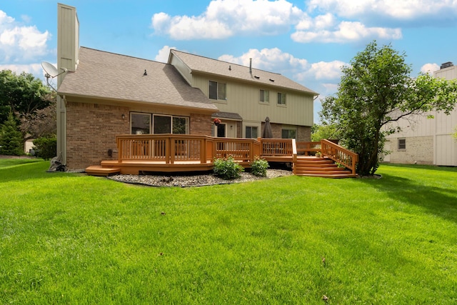 24609 Redwing Dr, Novi, MI 48374 - rear view of house featuring a deck, a chimney, a yard, and brick siding