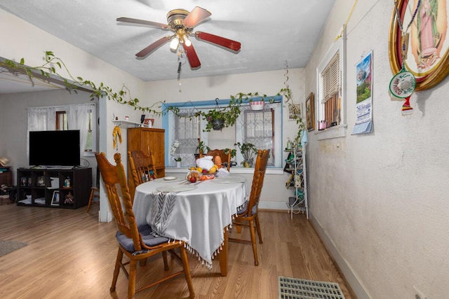 2113 Palace Ave SW, Grand Rapids, MI 49507 - dining space with light wood-style floors, ceiling fan, and baseboards