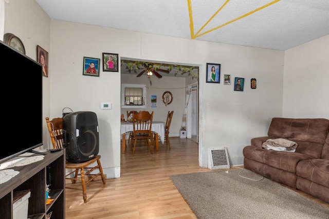 2113 Palace Ave SW, Grand Rapids, MI 49507 - living room with light wood-style flooring and a ceiling fan