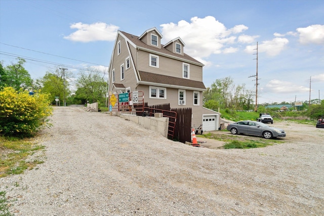 806 W Centre Ave, Portage, MI 49024 - view of front of property with driveway, a garage, and roof with shingles