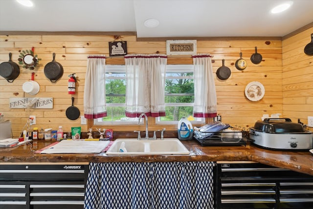 806 W Centre Ave, Portage, MI 49024 - kitchen featuring wooden walls, a sink, dark countertops, and beverage cooler