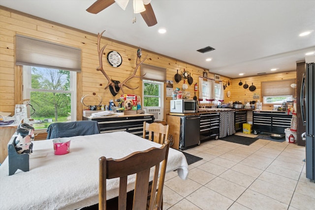 806 W Centre Ave, Portage, MI 49024 - dining area featuring wood walls, a workshop area, light tile patterned floors, recessed lighting, and ceiling fan