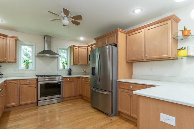 2501 Holiday House Rd, Saint Joseph, MI 49085 - kitchen with appliances with stainless steel finishes, wall chimney exhaust hood, a ceiling fan, light countertops, and recessed lighting
