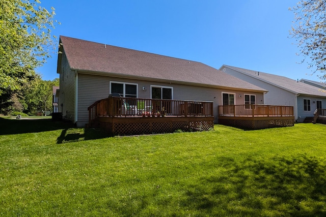 2501 Holiday House Rd, Saint Joseph, MI 49085 - back of house with a deck, a yard, and a shingled roof