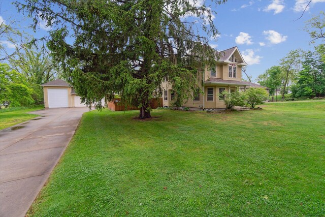 904 Schuring Rd, Portage, MI 49024 - view of front of home with concrete driveway, a front yard, and a garage