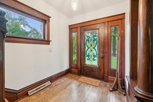 904 Schuring Rd, Portage, MI 49024 - entryway featuring healthy amount of natural light, hardwood / wood-style floors, and baseboards
