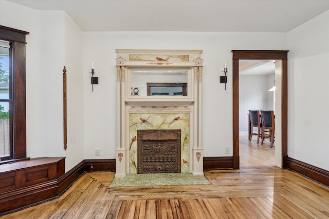 904 Schuring Rd, Portage, MI 49024 - unfurnished living room with wood finished floors, baseboards, and a premium fireplace