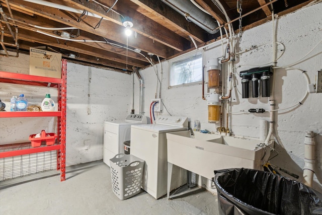 904 Schuring Rd, Portage, MI 49024 - below grade area featuring washing machine and clothes dryer, a central vacuum unit, and a sink