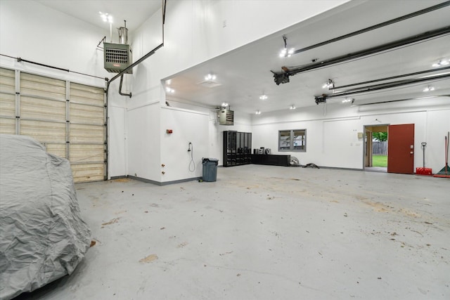 904 Schuring Rd, Portage, MI 49024 - garage with a heating unit and a garage door opener