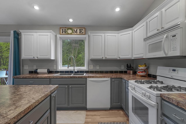 121 W Calgary Dr, Hastings, MI 49058 - kitchen with white appliances, gray cabinets, a sink, and recessed lighting