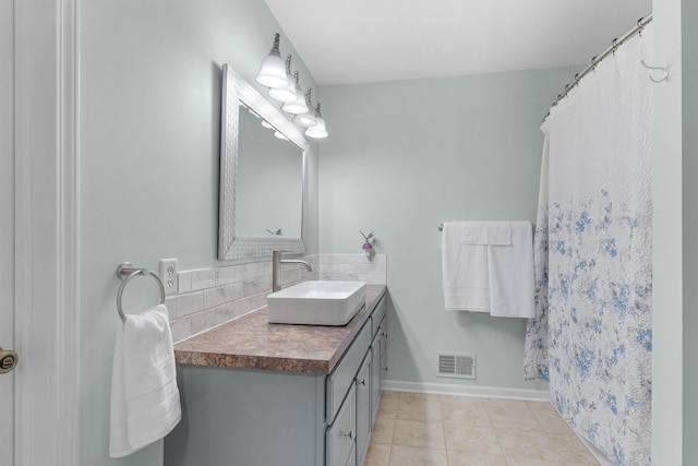 121 W Calgary Dr, Hastings, MI 49058 - bathroom with vanity, tile patterned flooring, and baseboards