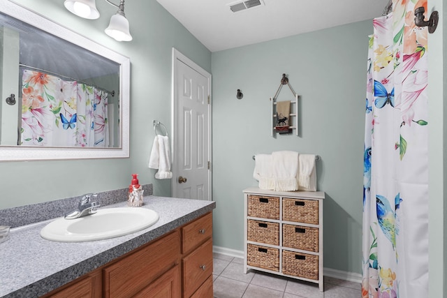 121 W Calgary Dr, Hastings, MI 49058 - bathroom featuring vanity, tile patterned flooring, a shower with curtain, and baseboards
