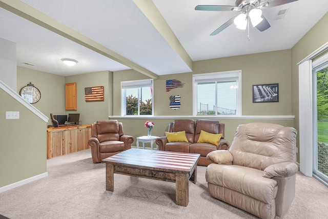 121 W Calgary Dr, Hastings, MI 49058 - living room with light colored carpet, a ceiling fan, and baseboards