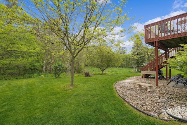 121 W Calgary Dr, Hastings, MI 49058 - view of green lawn with a deck and stairs