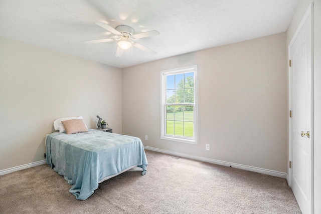1001 Goodsell St, Otsego, MI 49078 - carpeted bedroom featuring baseboards and a ceiling fan