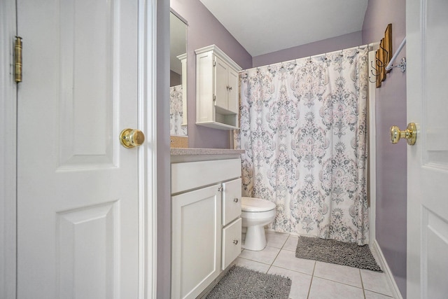 1001 Goodsell St, Otsego, MI 49078 - full bathroom with tile patterned floors, vanity, toilet, and curtained shower