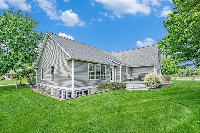 1001 Goodsell St, Otsego, MI 49078 - back of house featuring a shingled roof and central AC