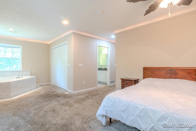 4175 Huntington Ave NE, Grand Rapids, MI 49525 - carpeted bedroom with crown molding, ensuite bath, ceiling fan, baseboards, and recessed lighting