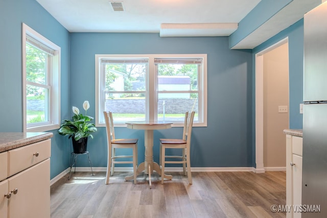 4175 Huntington Ave NE, Grand Rapids, MI 49525 - dining room with light wood-style flooring, plenty of natural light, and baseboards
