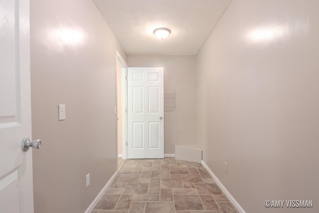 4175 Huntington Ave NE, Grand Rapids, MI 49525 - corridor featuring stone finish flooring and baseboards
