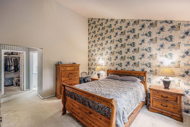 3311 Hickory Dr, Lake Orion, MI 48359 - bedroom featuring vaulted ceiling, carpet floors, wallpapered walls, baseboards, and a closet
