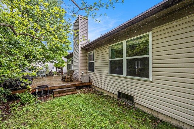3311 Hickory Dr, Lake Orion, MI 48359 - view of grassy yard with a deck