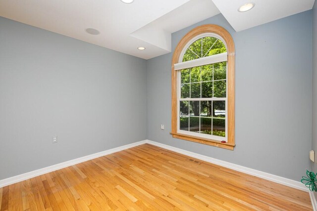 4936 Ravine Ct, Ann Arbor, MI 48105 - spare room featuring baseboards, light wood-style floors, and recessed lighting