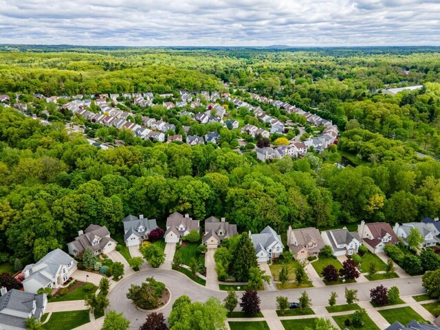 4936 Ravine Ct, Ann Arbor, MI 48105 - aerial perspective of suburban area featuring a heavily wooded area