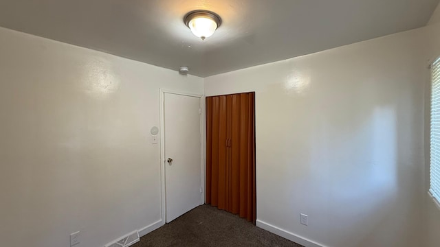 15852 Wabash St, Detroit, MI 48238 - unfurnished room with dark carpet and baseboards