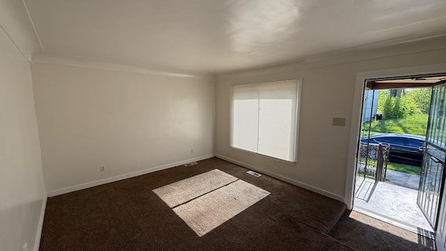 15852 Wabash St, Detroit, MI 48238 - unfurnished room with dark carpet and baseboards