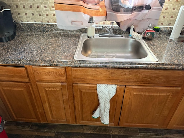 18294 Marlowe St, Detroit, MI 48235 - kitchen view of a sink, brown cabinetry, and backsplash