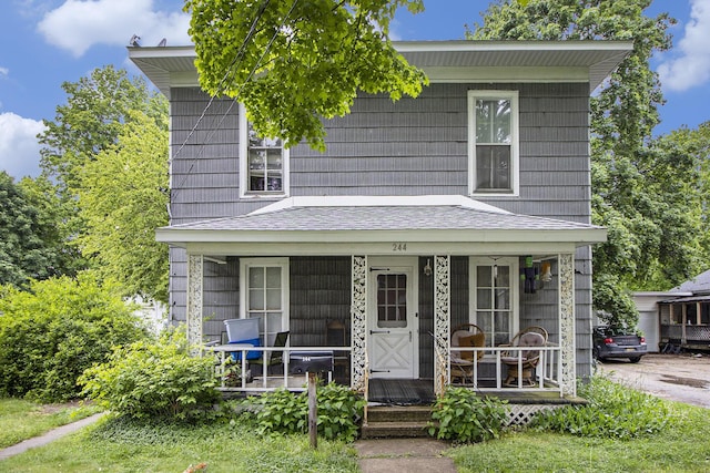 244 W Franklin St, Otsego, MI 49078 - view of front facade with covered porch and roof with shingles