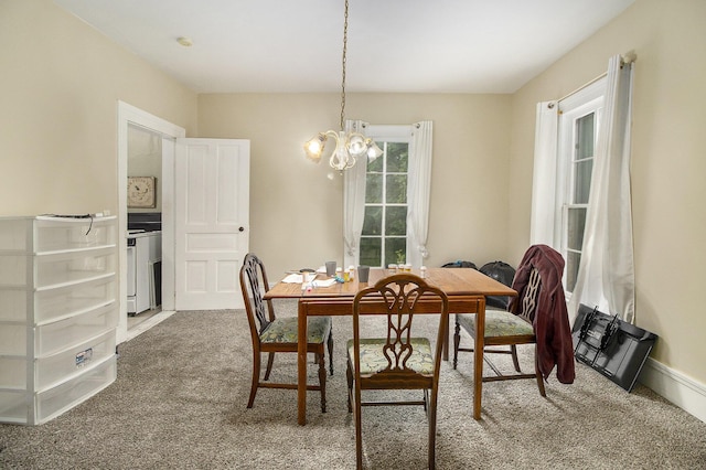 244 W Franklin St, Otsego, MI 49078 - dining space featuring carpet flooring, a chandelier, and baseboards