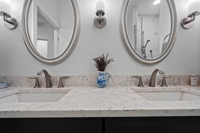 211 W Kingsley St, Ann Arbor, MI 48103 - bathroom with double vanity and a marble finish shower