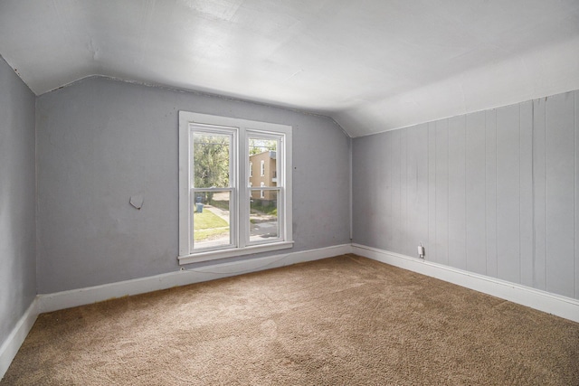 527 Jackson St W, Battle Creek, MI 49037 - additional living space featuring vaulted ceiling, carpet floors, and baseboards